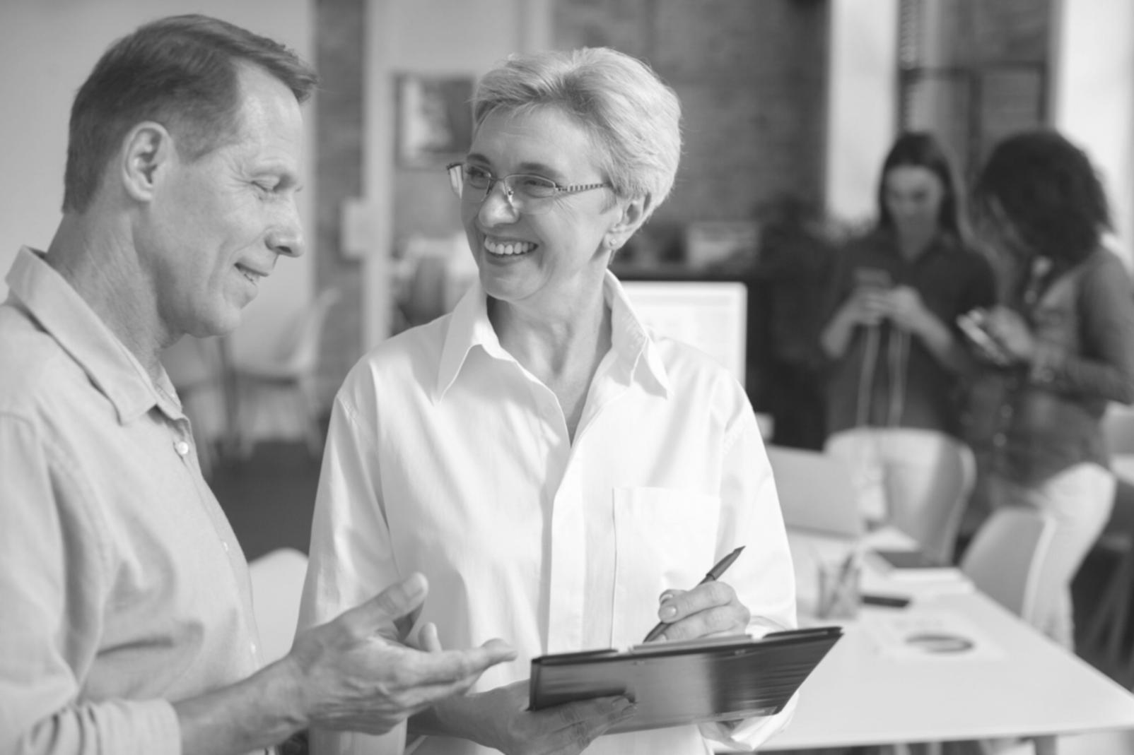 Business professional reviewing CRM system workflow analysis on laptop