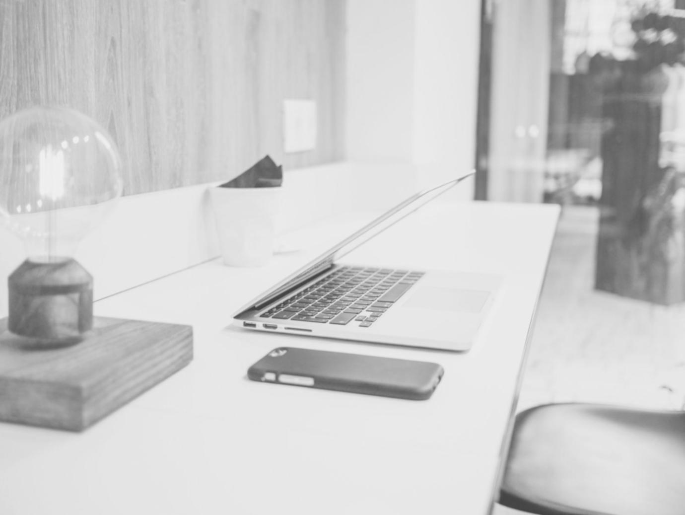 Professional workspace showing CRM implementation planning and strategy session